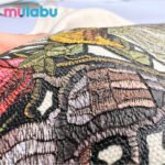 Close-up of miilabu puff print fabric with textured embroidery, crafted from GRS, BCI, and OCS certified canvas, recycled cotton, RPET, organic cotton, T/C fabric, satin, Martindale, oxford, and outdoor waterproof materials for sustainable bags and outdoor gear.