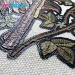 Close-up of miilabu puff print fabric with textured botanical embroidery, made from GRS, BCI, and OCS certified canvas, recycled cotton, RPET, organic cotton, T/C fabric, satin, Martindale, oxford, and waterproof outdoor bag materials.