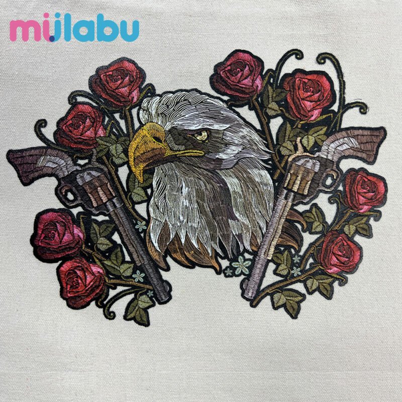 Embroidered puff print fabric featuring an eagle, roses, and revolvers, suitable for eco bags, handbags, and outdoor products.